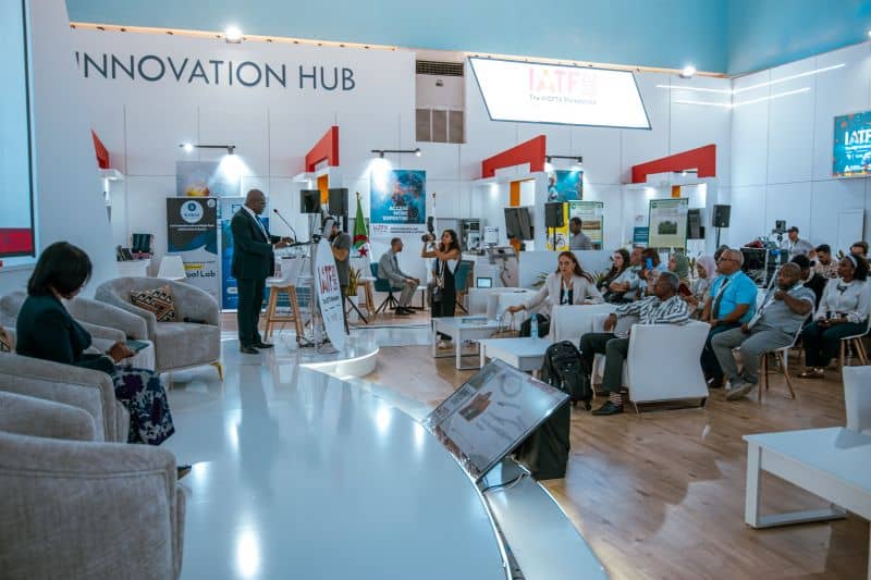 Investors, tourism leaders and technology innovators networking at a tourism trade fair in Africa focused on investment, culture and innovation.